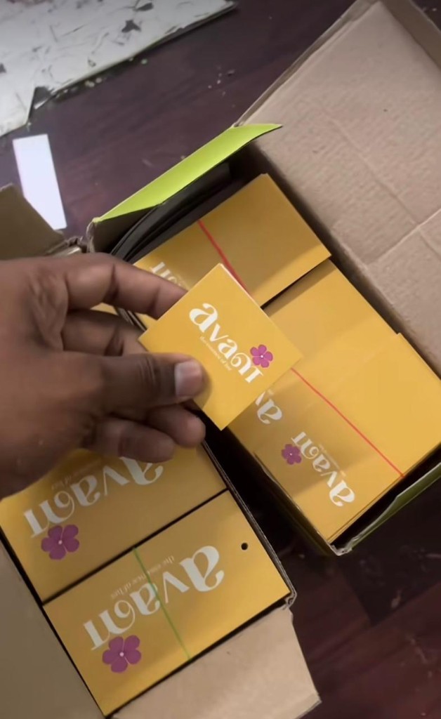 Avani folding card sample — mustard yellow with logo