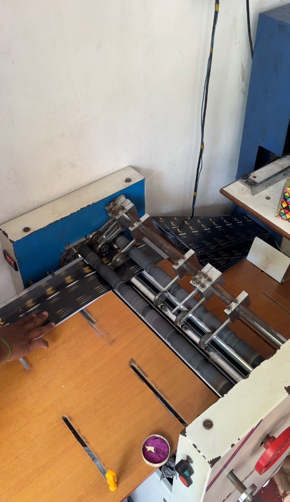 Folding machine feeding printed sheets