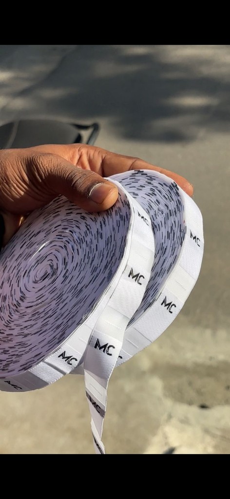 Woven label rolls with custom MC branding